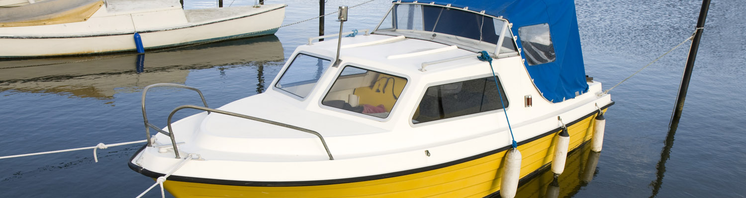 Reflections from a small boat in Norsminde Harbour, Denmark